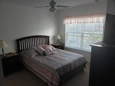 a bedroom with a bed and a window at Kissimmee 3bed Villa Near Disney in Kissimmee
