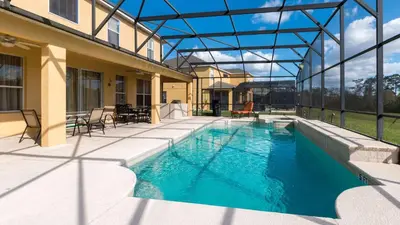 a swimming pool in the middle of a house at Mickeys Maingate Mansion in Kissimmee