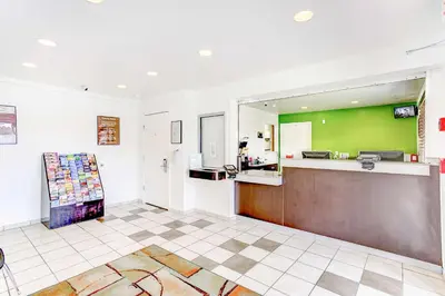 a kitchen with a counter and a green wall at Studio 6 Extended Stay - Kissimmee, FL - Orlando in Orlando