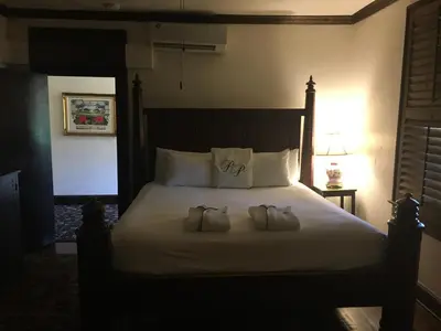a bedroom with a large bed with two pillows at Park Plaza Hotel Orlando - Winter Park in Orlando