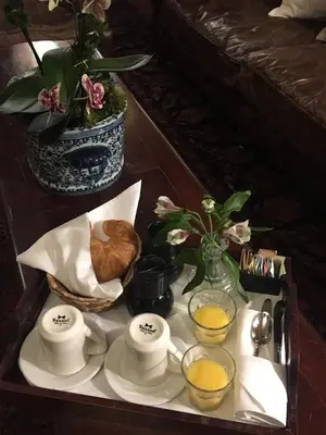 a tray with cups and plates of food on a table at Park Plaza Hotel Orlando - Winter Park in Orlando