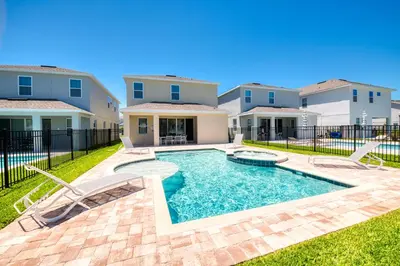 a pool in the backyard of a house at Welcoming Home With Air Hockey Table And Waterpark & Resort Access Near Disney At Encore Resorts Reunion - 321Bu in Kissimmee