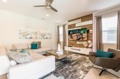 a living room with a couch and a tv at Cozy Home With Private Pool, Air Hockey Table And Themed Room Near Disney With Waterpark & Resort Access At Encore Resort - 7458Mr in Kissimmee