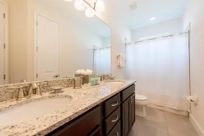 a bathroom with a large sink and a toilet at Lovely Home With Private Pool And Air Hockey Table Near Disney With Waterpark & Resort Access At Encore Resort - 7467Mr in Kissimmee