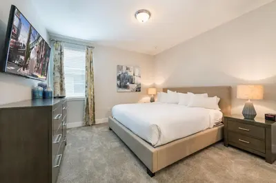 a bedroom with a bed and a dresser and a window at Remarkable Home Near Disney With Theater & Themed Rooms With Waterpark & Resort Access At Encore Resort - 7660Ff in Kissimmee