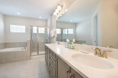 a bathroom with a sink and a shower and a tub at Cozy Home With Private Pool, Air Hockey Table Near Disney With Waterpark & Resort Access At Encore Resort - 7702Gr in Kissimmee