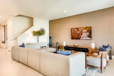 a living room with a couch and a table at Chic Home With Mini Soccer Field, Golf Near Disney With Waterpark & Resort Access At Encore Resort - 7715Ff in Kissimmee