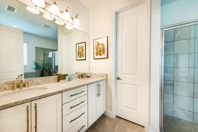 a bathroom with a sink and a mirror at Chic Home With Mini Soccer Field, Golf Near Disney With Waterpark & Resort Access At Encore Resort - 7715Ff in Kissimmee