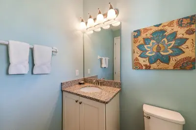 a bathroom with a sink and a mirror at Spectacular Home With Theater, Theme Rooms Near Disney With Waterpark & Resort Access At Encore Resort - 7734Gr in Kissimmee