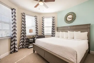 a bedroom with a bed and a ceiling fan at Spectacular Home With Theater, Theme Rooms Near Disney With Waterpark & Resort Access At Encore Resort - 7734Gr in Kissimmee