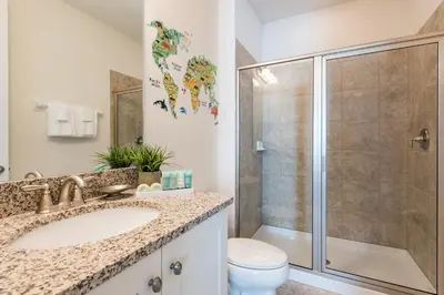 a bathroom with a sink and a shower at Spectacular Home With Theater, Theme Rooms Near Disney With Waterpark & Resort Access At Encore Resort - 7734Gr in Kissimmee