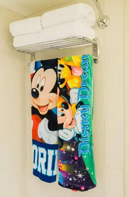 a towel rack in a bathroom with mickey towels at Hyatt Place Orlando/Lake Buena Vista in Orlando