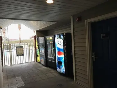 a front door of a building with vending machines at InTown Suites Extended Stay Orlando FL - Universal in Orlando