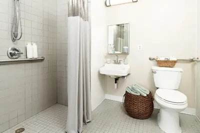 a bathroom with a toilet and a sink at InTown Suites Extended Stay Orlando FL - South in Orlando