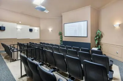 a lecture room with black chairs and a screen at Fantastic Condo - 2 Miles from Disney Pool View Windsor Hills in Orlando