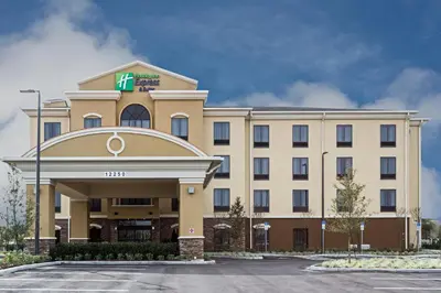 a hotel building with a hilton at Holiday Inn Express Hotel & Suites Orlando East-UCF Area by IHG in Orlando