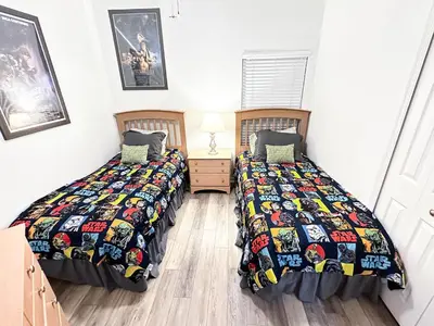 two beds sitting next to each other in a bedroom at Affordable Luxury Home Near Walt Disney World - Sunshine Villa at Glenbrook Resort, Orlando, Florida in Orlando