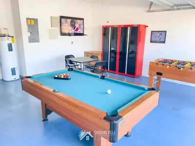 a pool table in a room with a ping pong ball at Affordable Luxury Home Near Walt Disney World - Sunshine Villa at Glenbrook Resort, Orlando, Florida in Orlando