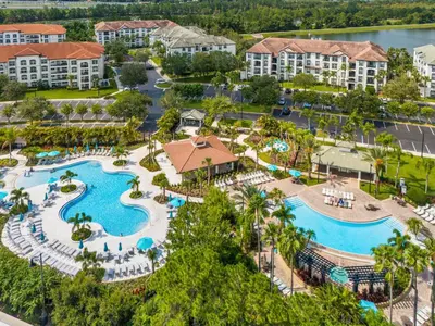 an aerial view of a resort with two pools at Ground-Floor Vista Cay Condo Near Clubhouse Pool in Orlando