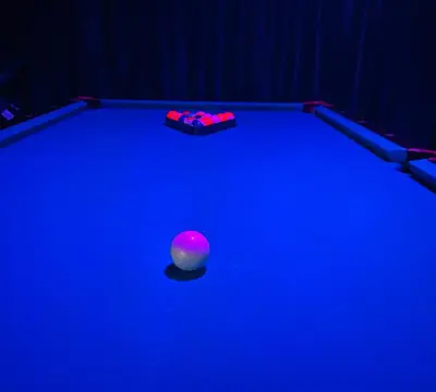 a pool table with a ball and a cue at My Disney Castle in Orlando