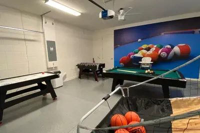 a room with a pool table and balls on the wall at 3830 Premier Villa 6Bd Private Pool and Game Room in Kissimmee