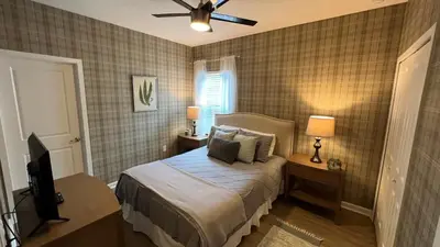 a bedroom with a bed and a ceiling fan at 3830 Premier Villa 6Bd Private Pool and Game Room in Kissimmee