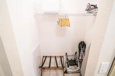 a small closet with a ladder and a stool at Only 5 Miles from Disney! Free Water Park! 2 Bed, 2 Bath Condo, Sleeps 8 in Kissimmee
