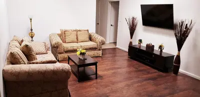 a living room with two couches and a flat screen tv at D4 Large Private Master Room & Bath with 55