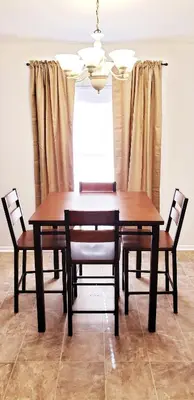 a dining room table with two chairs and a chandelier at D4 Large Private Master Room & Bath with 55