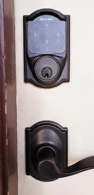 a small television on a wall with a door at D4 Large Private Master Room & Bath with 55
