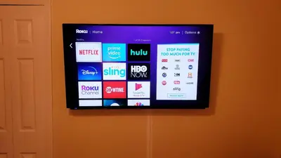 a tv on a wall with a bunch of websites at B2 Private Room With 55