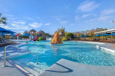 a swimming pool at a resort with a slide at Hilton Vacation Club Aqua Sol Orlando West in Orlando