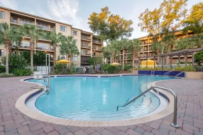 a large swimming pool in front of a building at Hilton Vacation Club Aqua Sol Orlando West in Orlando