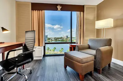 an office with a desk and chair and a window at Best Western Orlando Gateway Hotel in Orlando