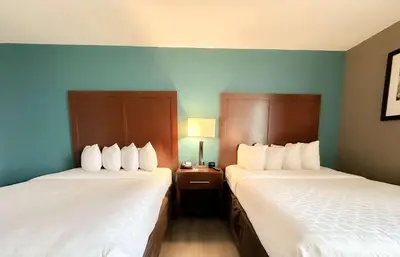 two beds in a hotel room with at The Adventure Hotel by the Parks in Orlando
