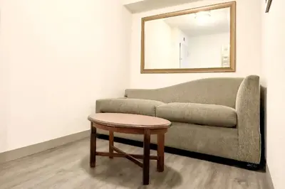 a living room with a couch and a table at The Adventure Hotel by the Parks in Orlando