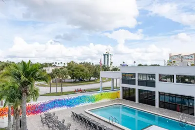 a view of a building with a swimming pool at Hotel Monreale Express International Drive Orlando in Orlando