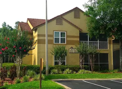 a house with a parking lot in front of it at Blue Tree Resort at Lake Buena Vista in Orlando