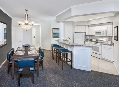 a kitchen and dining room with a table and chairs at Caribe Royale Orlando in Orlando