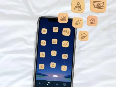 an iphone laying on a bed with icons on it at Sleep Inn & Suites Orlando International Airport in Orlando