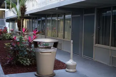 a trash can sitting in front of a building at Celebration Suites in Orlando