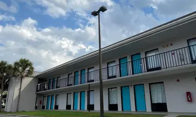 a building with colorful windows and a street light at Clarion Inn & Suites Kissimmee-Lake Buena Vista South in Kissimmee
