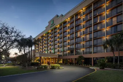 a hotel with lights on the side of a road at Holiday Inn & Suites Orlando SW - Celebration Area by IHG in Orlando