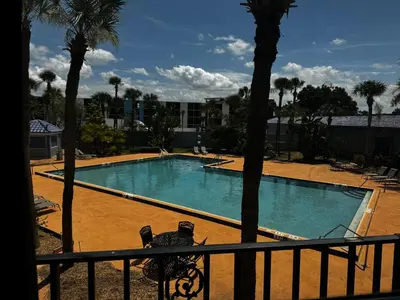 a view of a swimming pool from a balcony at Monumental Movieland Hotel in Orlando
