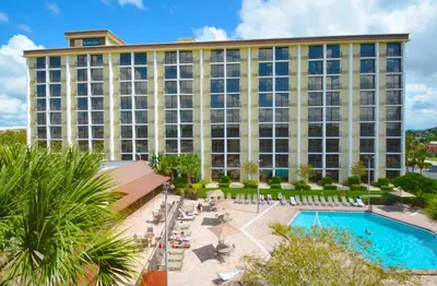 a hotel with a pool and a resort at Rosen Inn Closest to Universal in Orlando
