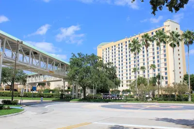a large building with a basketball court in front of it at Rosen Plaza Hotel Orlando Convention Center in Orlando