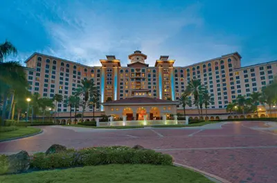 a large resort building with a parking lot in front of it at Rosen Shingle Creek Universal Blvd in Orlando