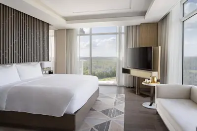 a hotel room with a bed and a tv at JW Marriott Orlando Bonnet Creek Resort & Spa in Orlando