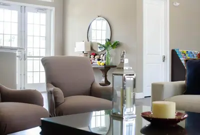 a living room with two chairs and a table at 3 Bedroom townhouse in luxury Resort, sleeps 8, 10 min to Disney! in Kissimmee