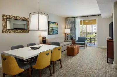 a living room and dining room with a table and chairs at Sheraton Vistana Villages Resort Villas, I-Drive Orlando in Orlando